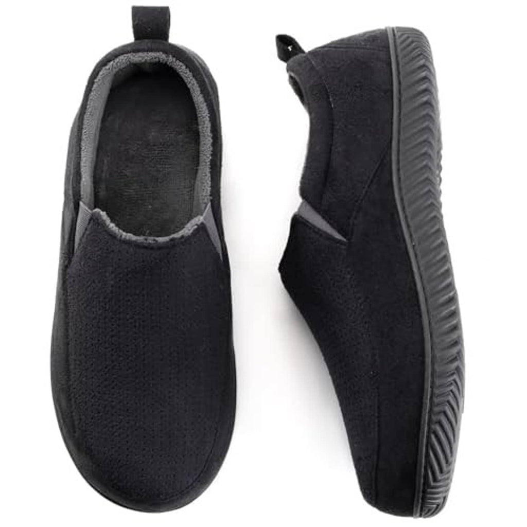 Black closed-back slippers with textured sole and plush-lined collar, side view.
