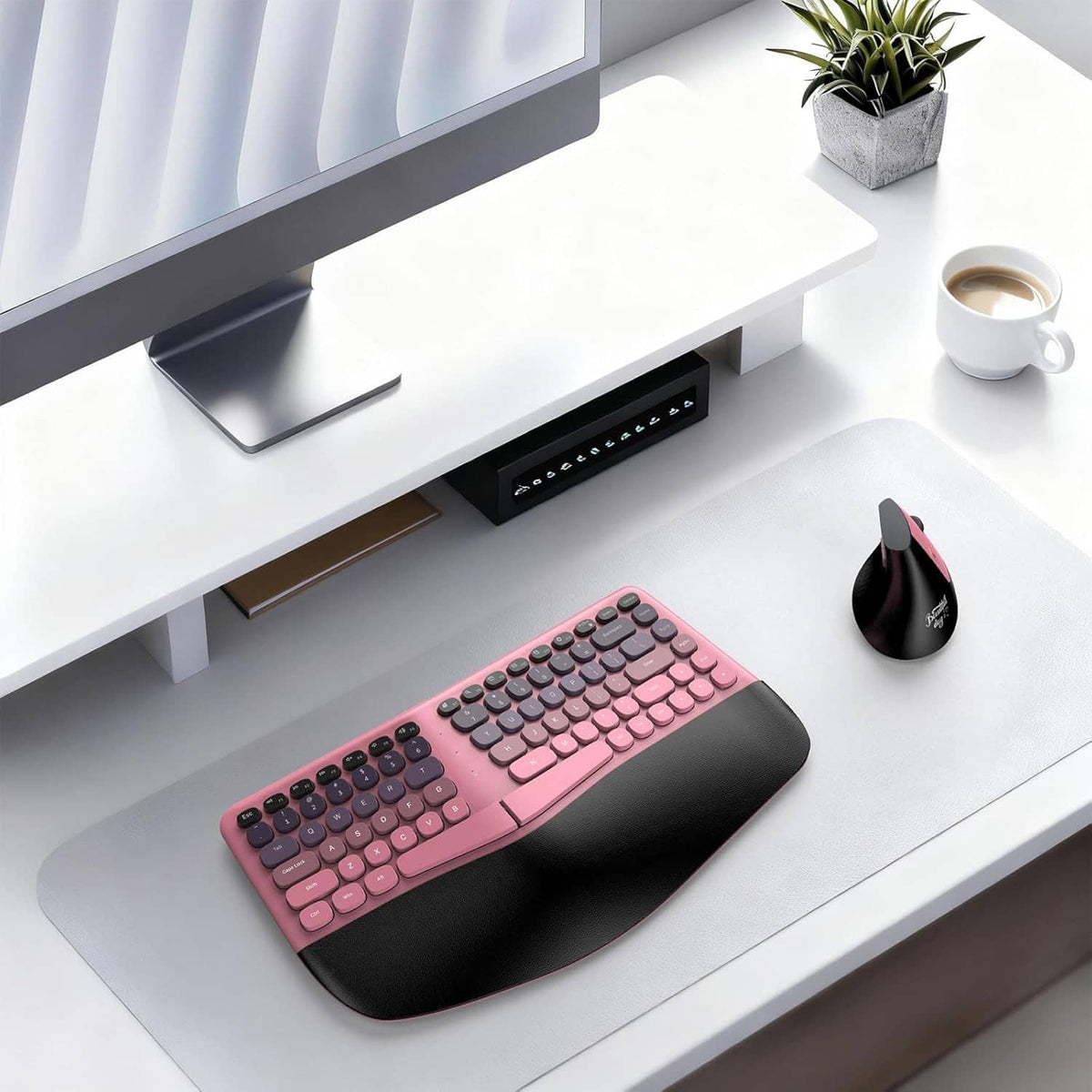 Pink and black split wireless keyboard with wrist rest and matching wireless mouse