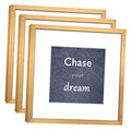 Set of three square gold aluminum photo frames with real glass, overlapping front view