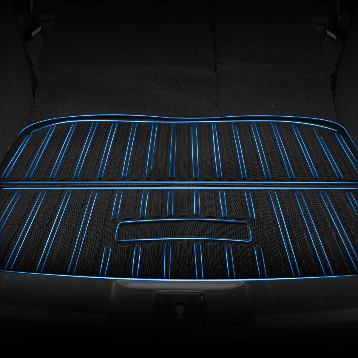 Black floor mat surface with raised grooves and blue directional stripes across it