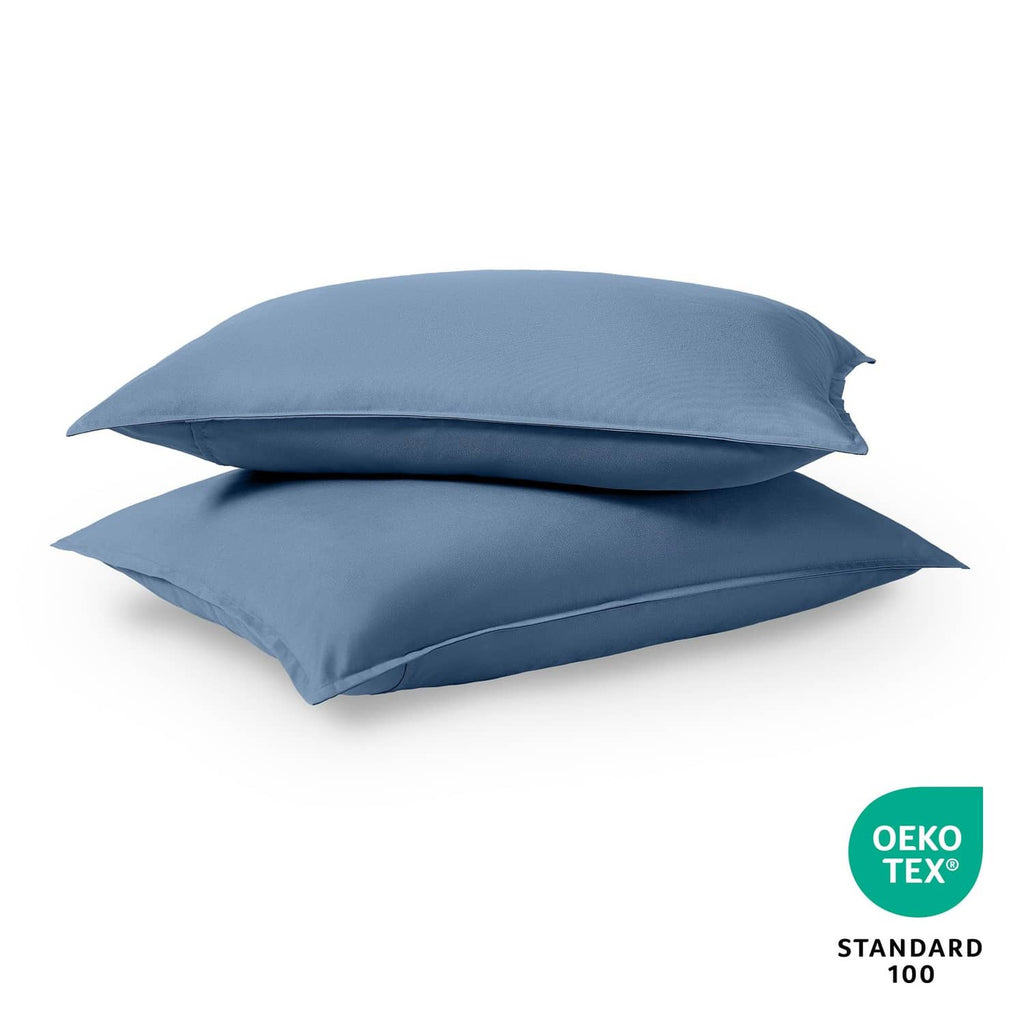 Blue standard pillow sham pair, neatly folded with envelope closure at the back