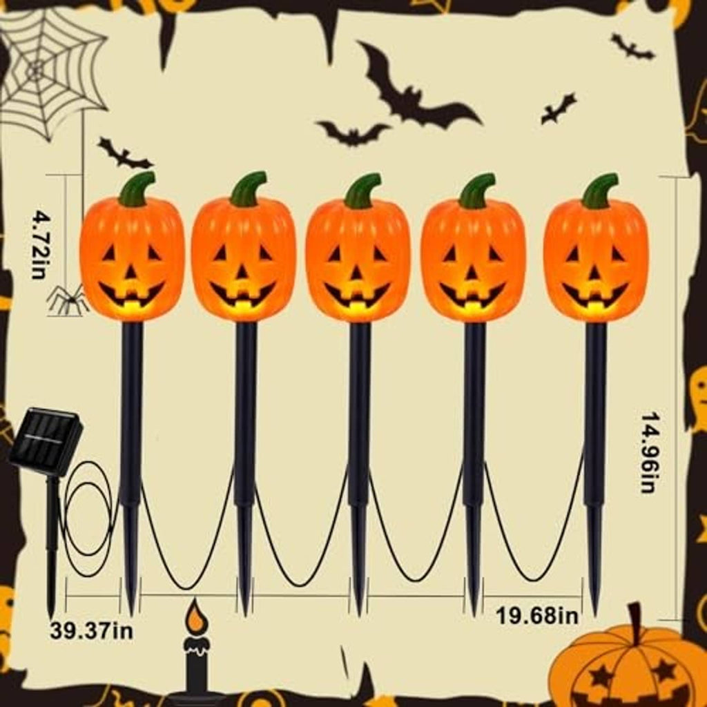 Jack-o'-lantern pumpkin stake lights on cardboard backing, solar panels included