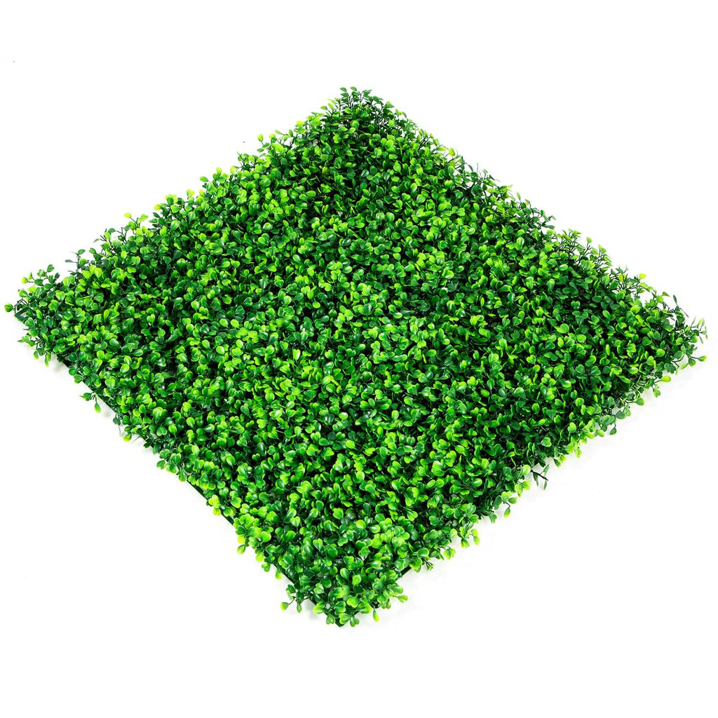 Artificial boxwood hedge panel with dense green foliage, viewed at a diagonal angle