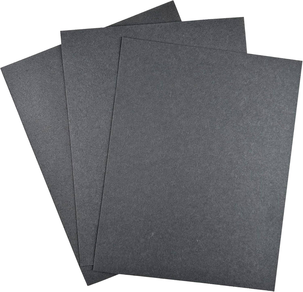 Set of four dark gray gasket paper sheets, layered and smooth with sharp edges