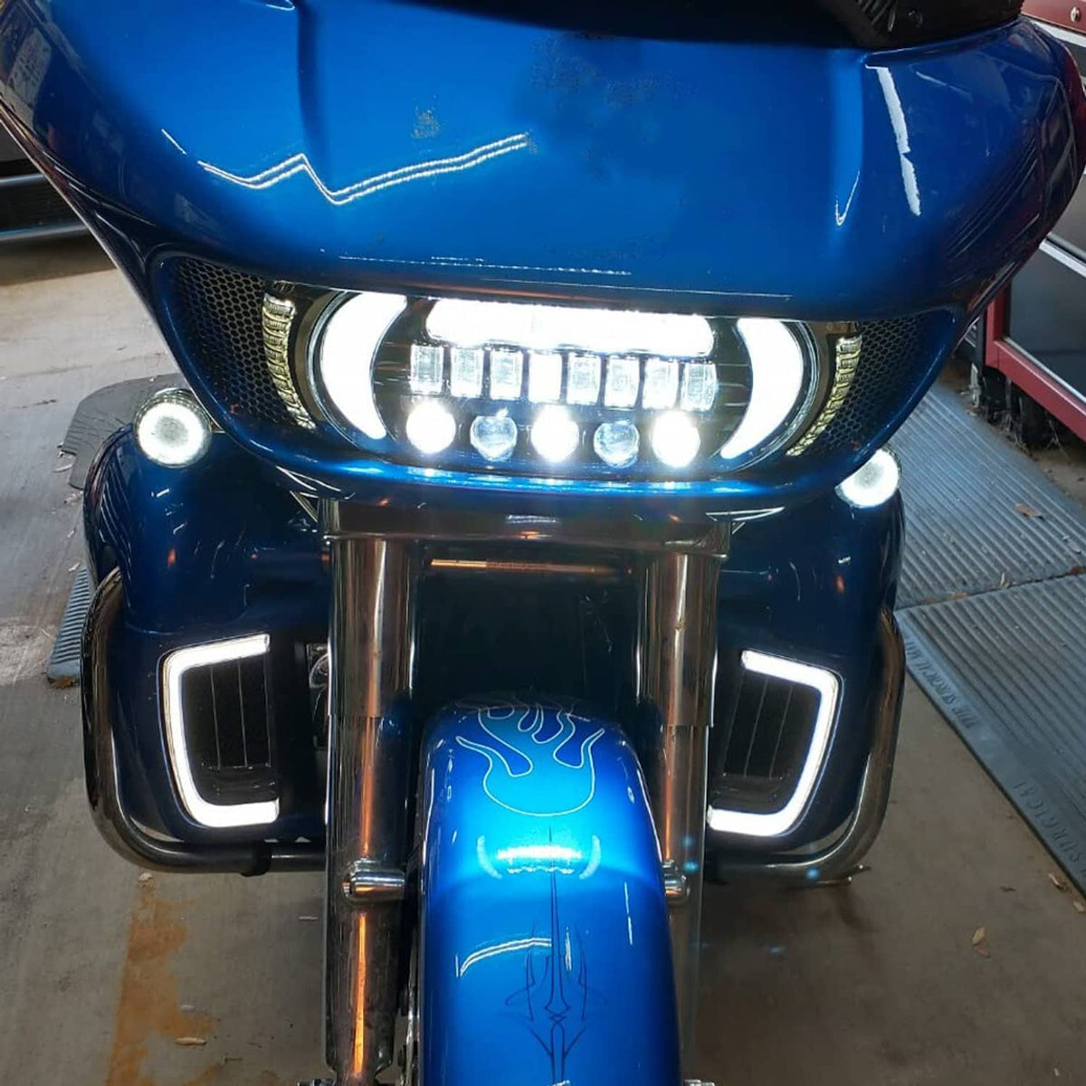 LED headlight lamp assembly showing lit DRL and white LED light bar on motorcycle front