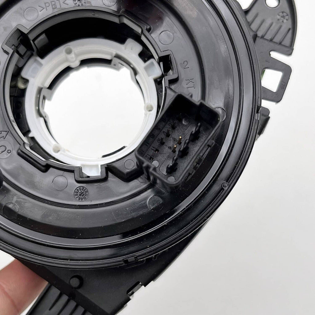 Close-up of clock spring circular contact ring and inner white coil housing