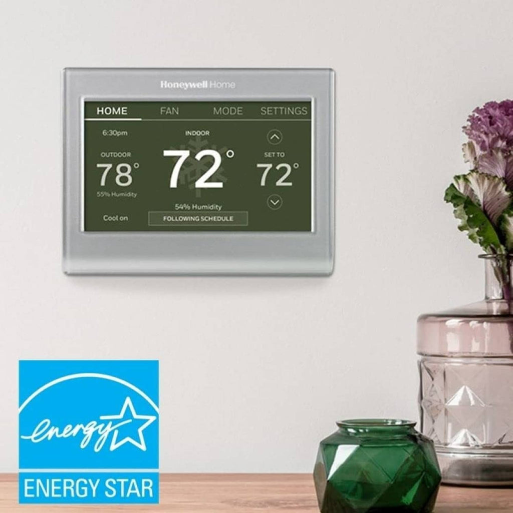 Gray Honeywell Home Wi-Fi smart color thermostat with digital temperature display