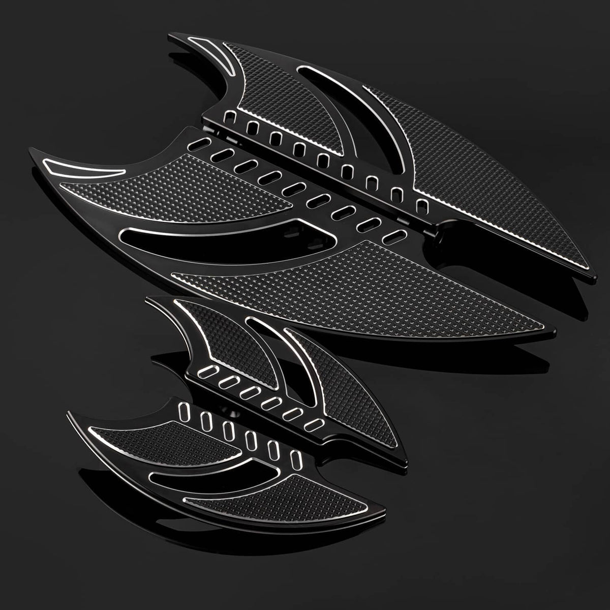 Set of textured black motorcycle floorboards with silver curved accents and pedal holes