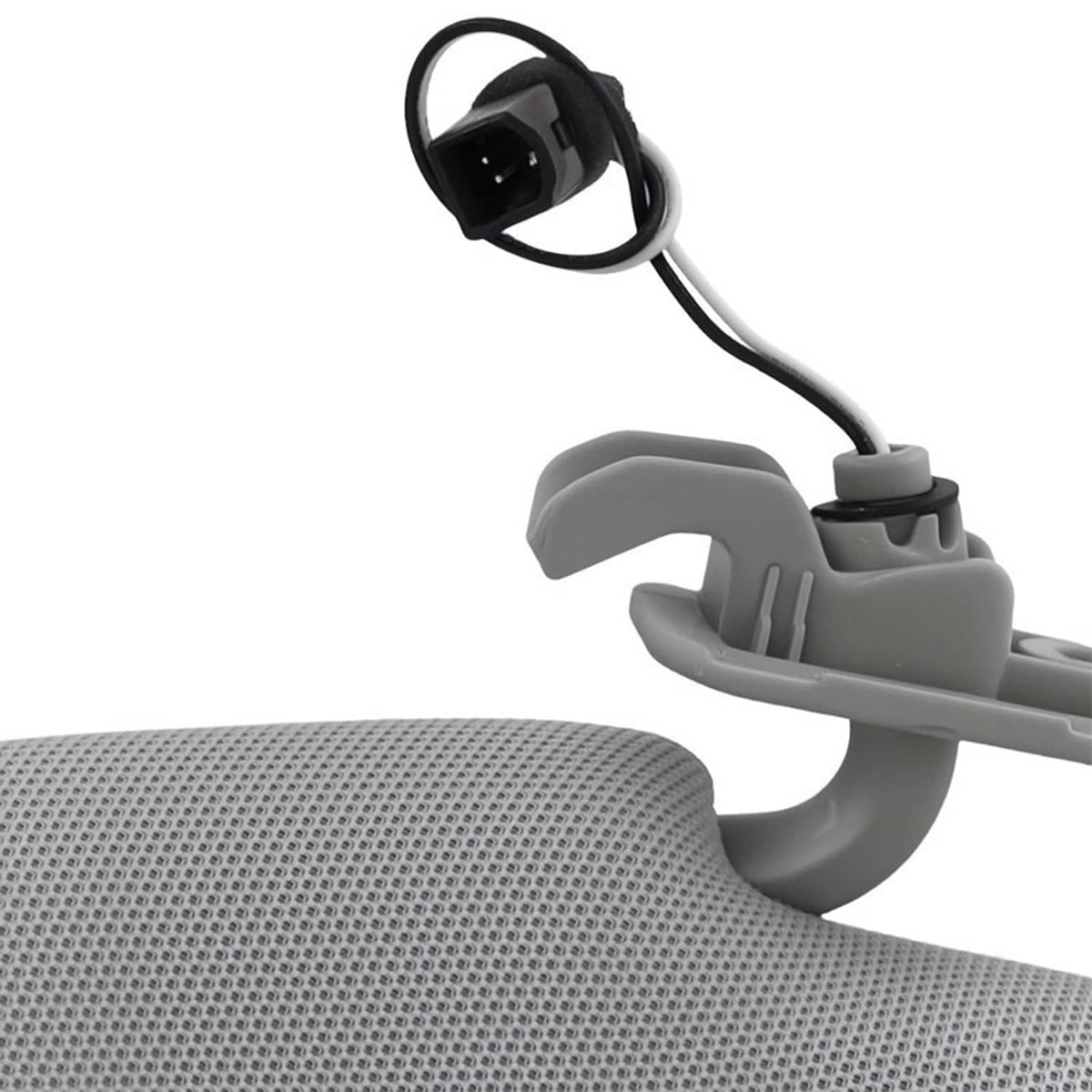 Gray sun visor mounting arm with wiring and connector, shown near textured panel
