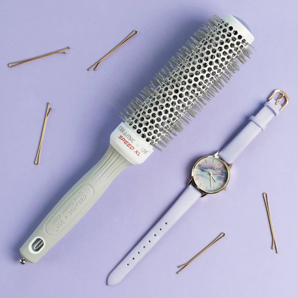 Round barrel hair brush with ceramic+ion bristles and white/grey handle.