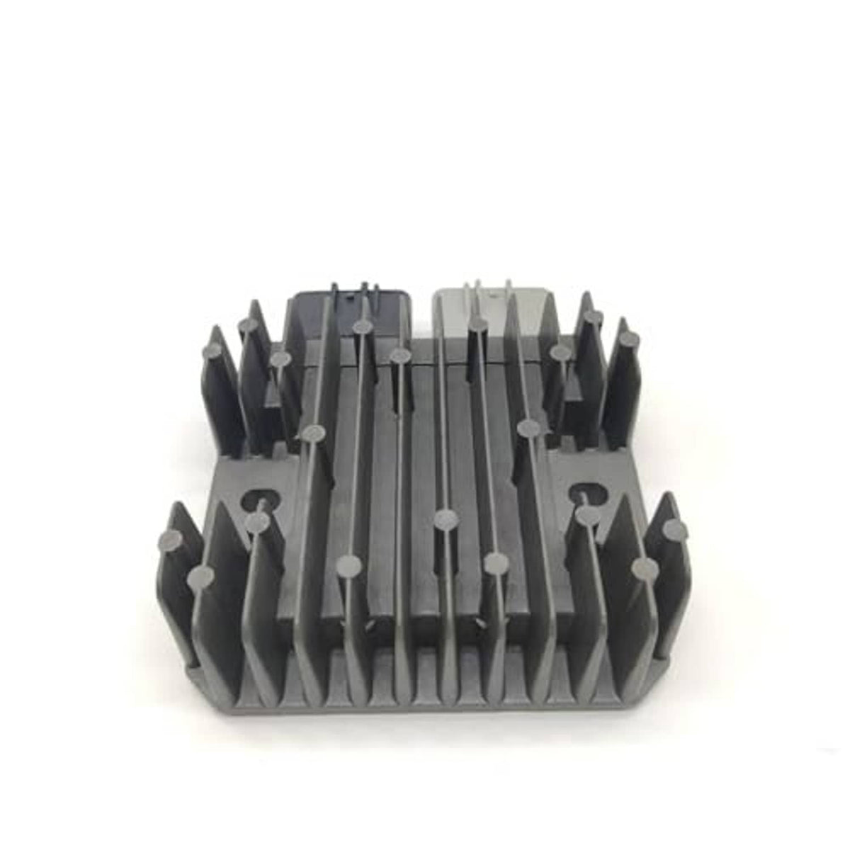 Voltage regulator rectifier heat sink with ribbed fins and center ridges