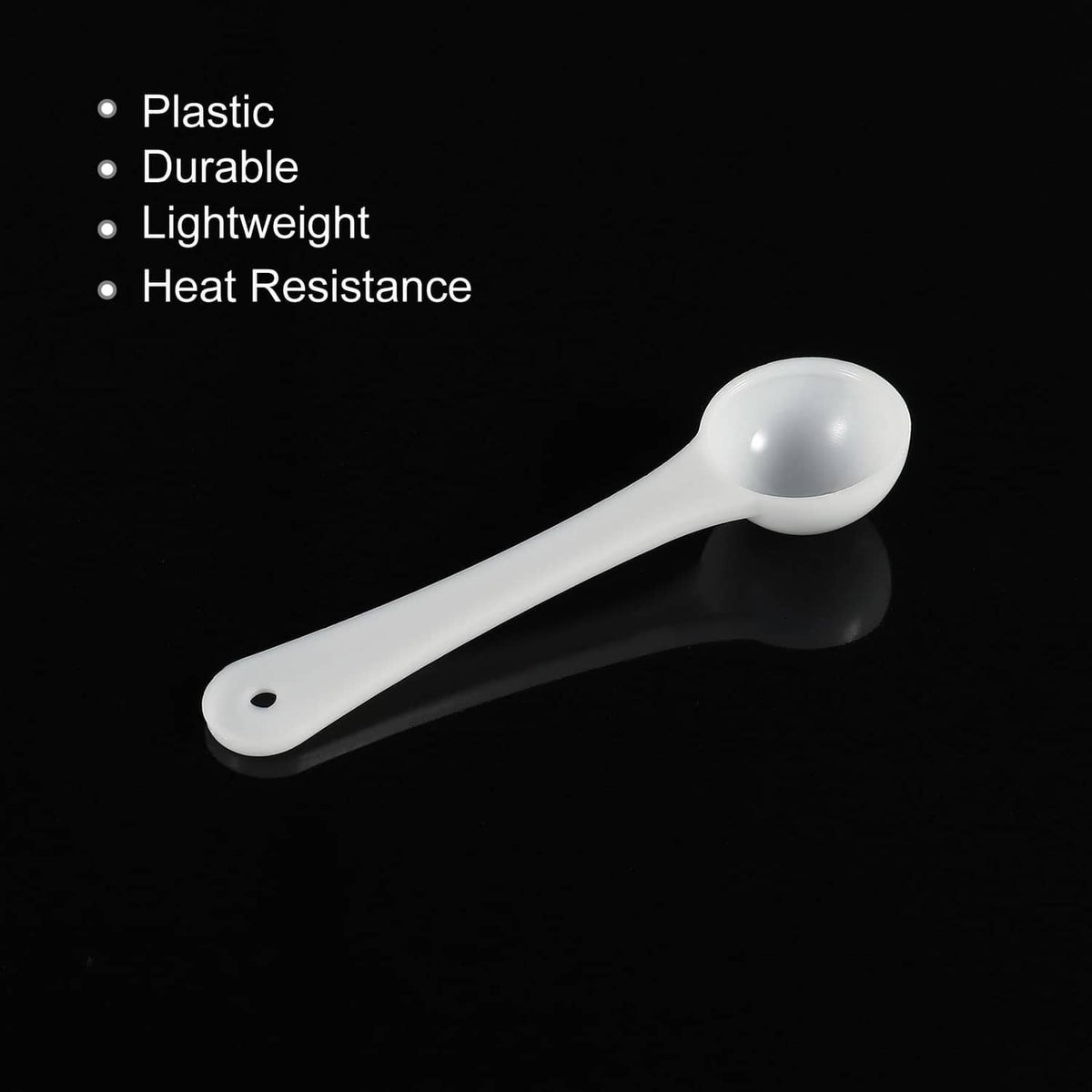 White plastic micro measuring spoon, round bowl with small hole on handle end
