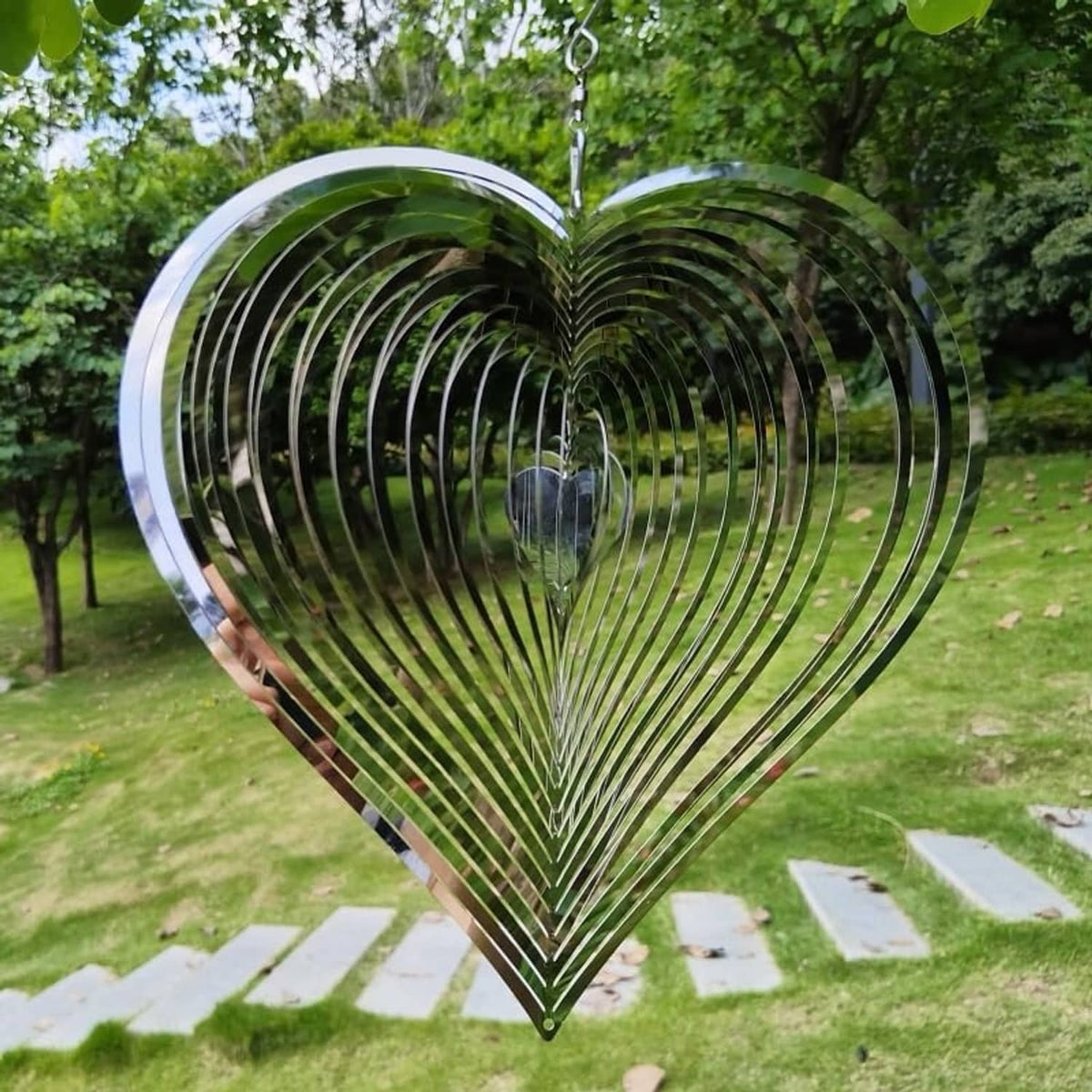 Heart-shaped hanging wind chime spinner with layered spiral blades, shiny silver