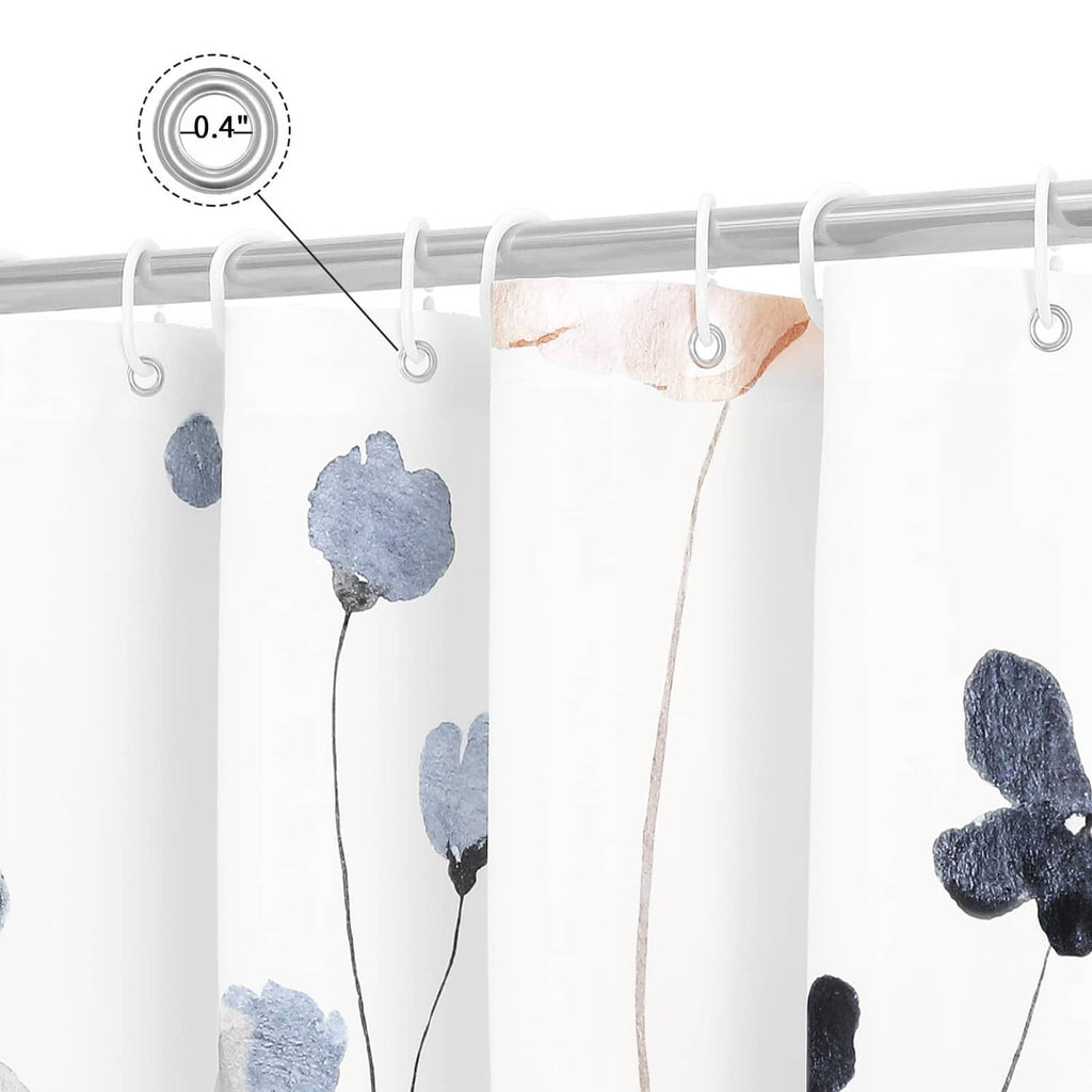 Close-up of blue floral shower curtain fabric with metal grommets on top