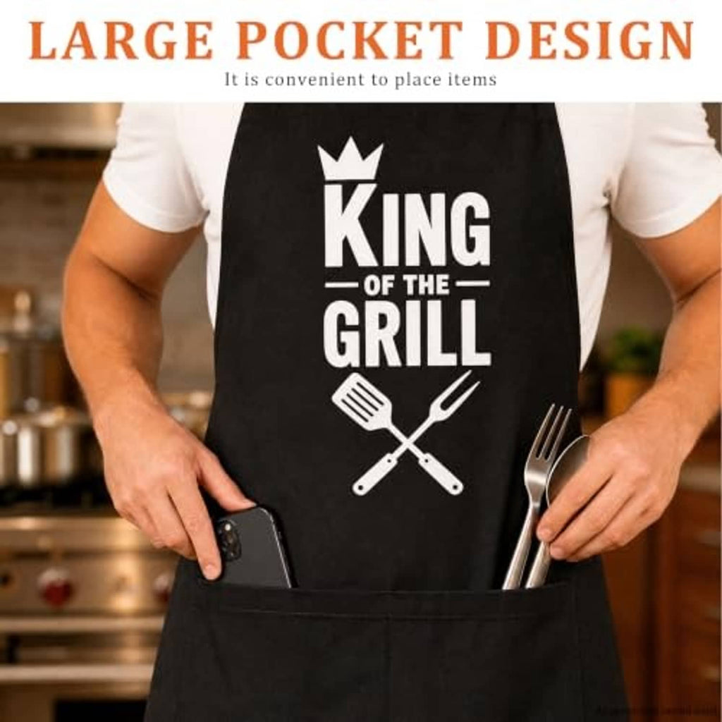 Black BBQ apron with a large front pocket and 'King of the Grill' crown logo