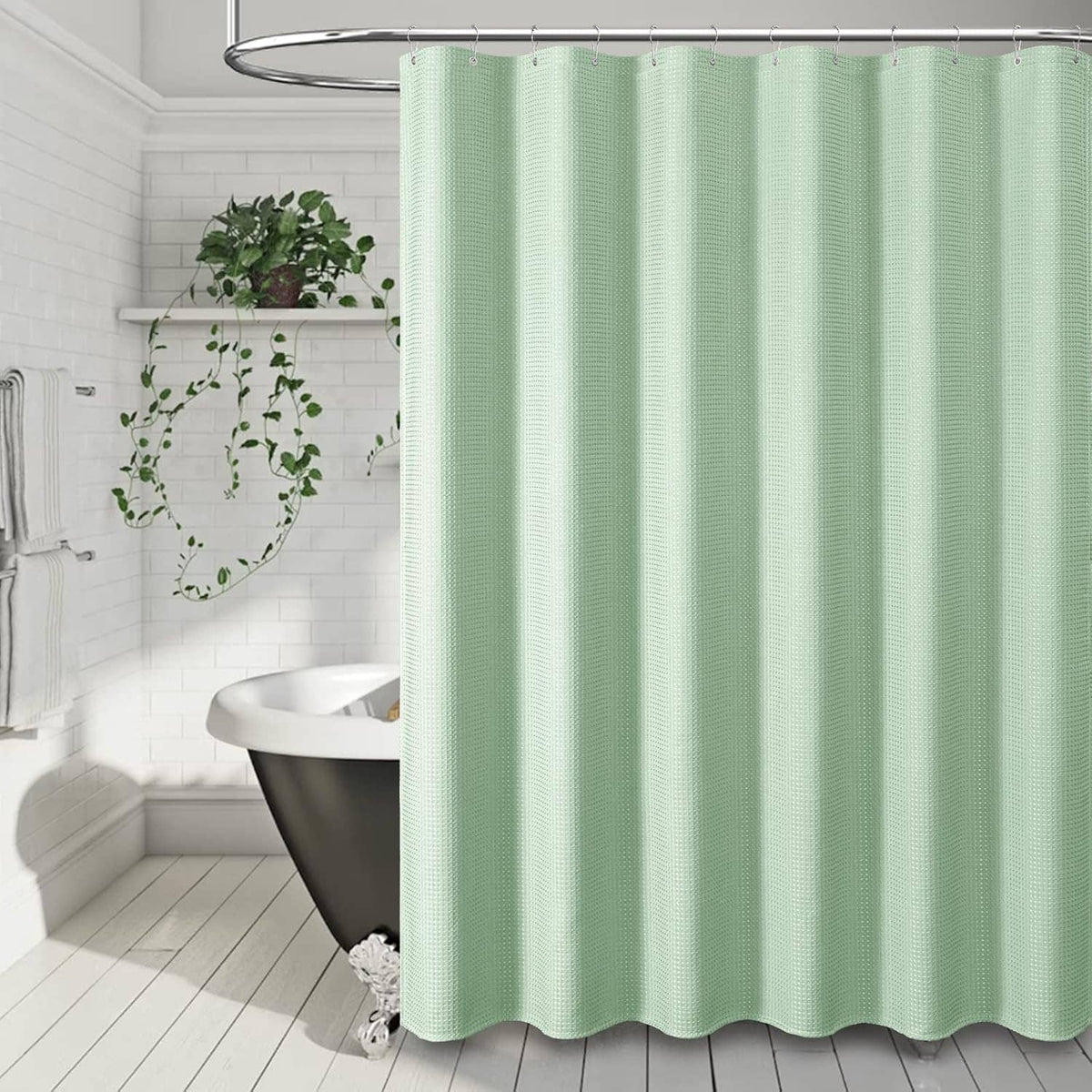 Mint green waffle-weave shower curtain hanging on metal rod with hooks, full-length view