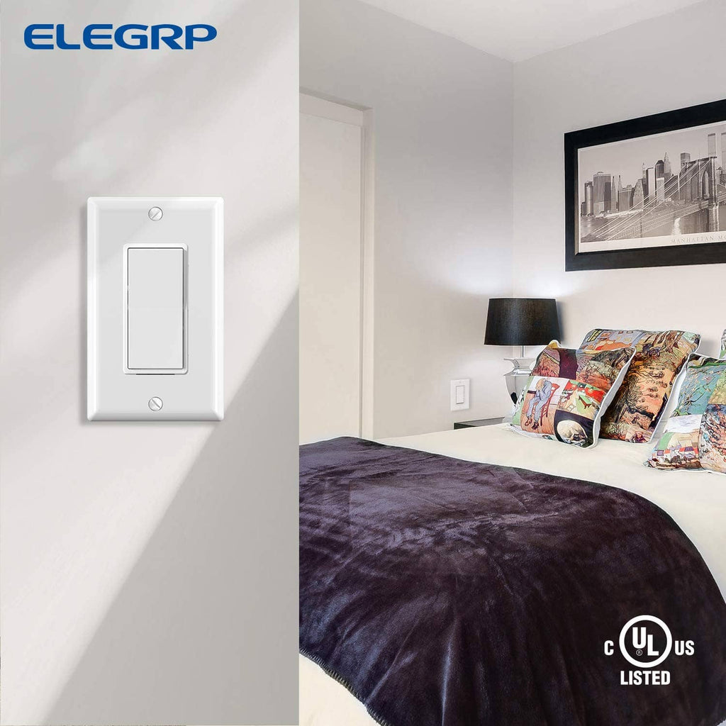Glossy white single-pole light switch on wall, compact rectangular rocker