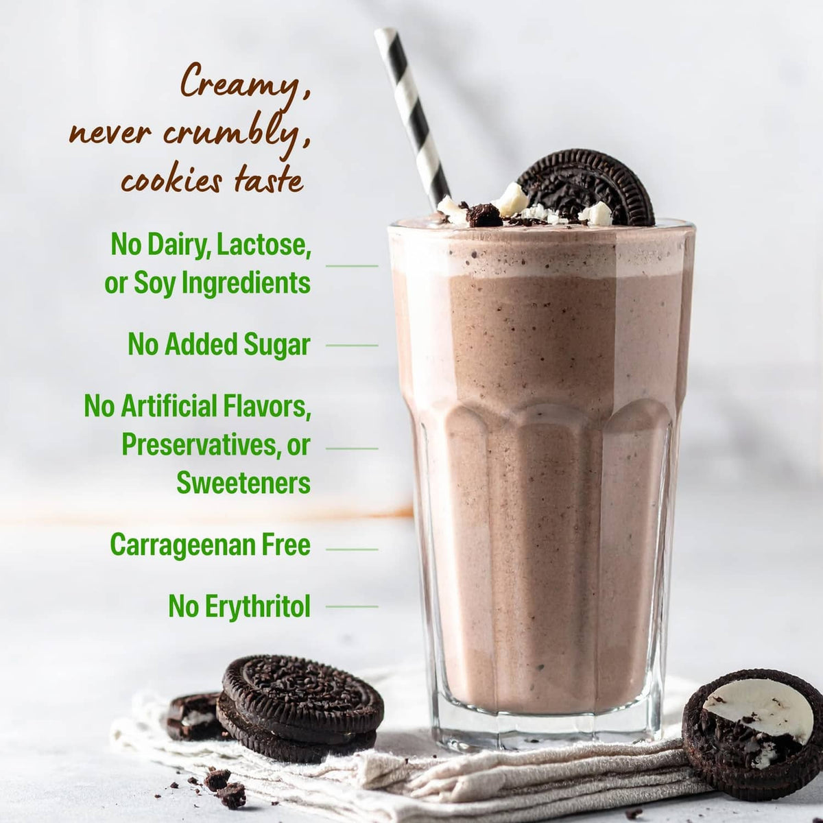 Glass of protein shake with chocolate cookies and striped straw