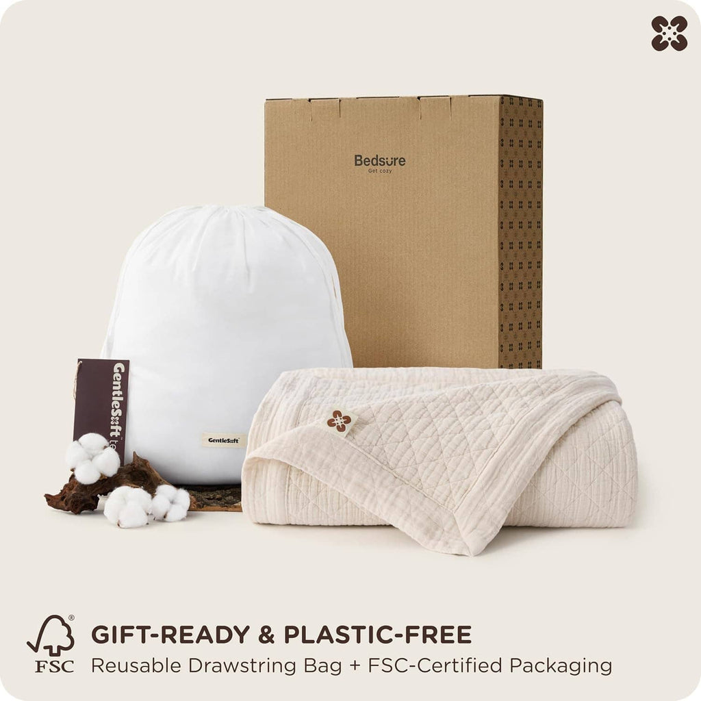 Reusable drawstring bag and packaged cream cotton muslin blanket for gift-ready storage