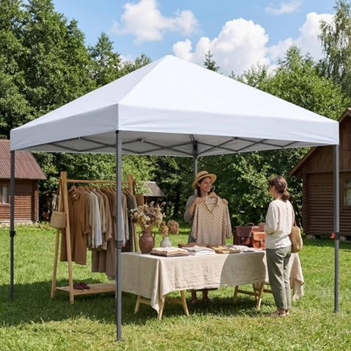 White pop-up canopy top on metal frame for outdoor events and markets
