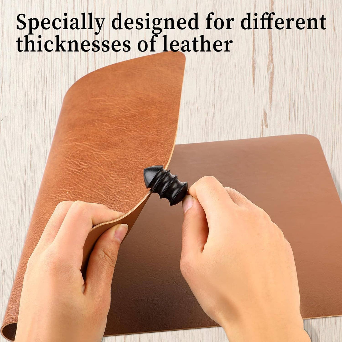 Hands burnishing a brown leather edge using a black conical burnisher bit