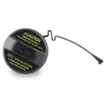 Black fuel cap with caution label and tether loop, close-up