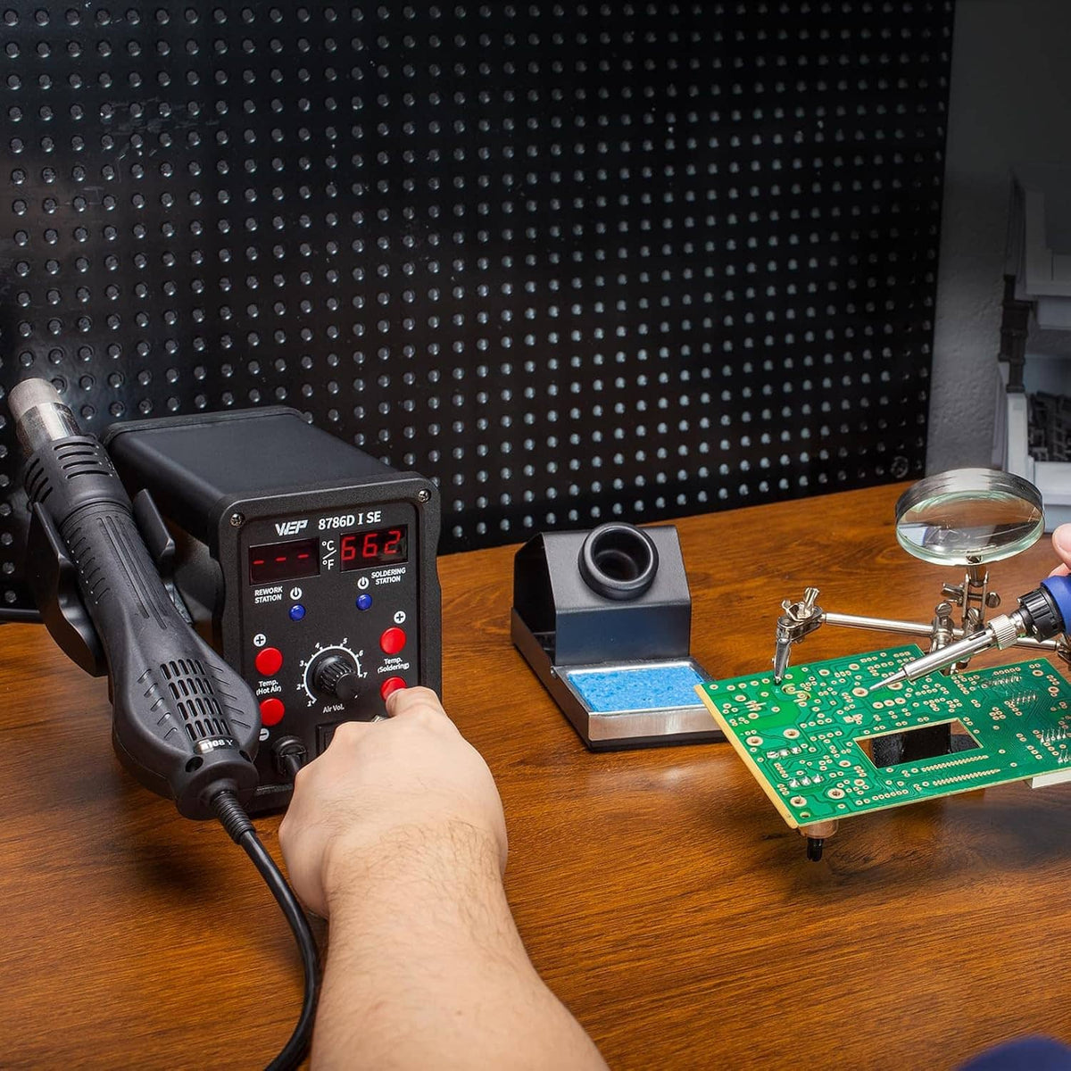 Hot air rework soldering station being used to solder a circuit board