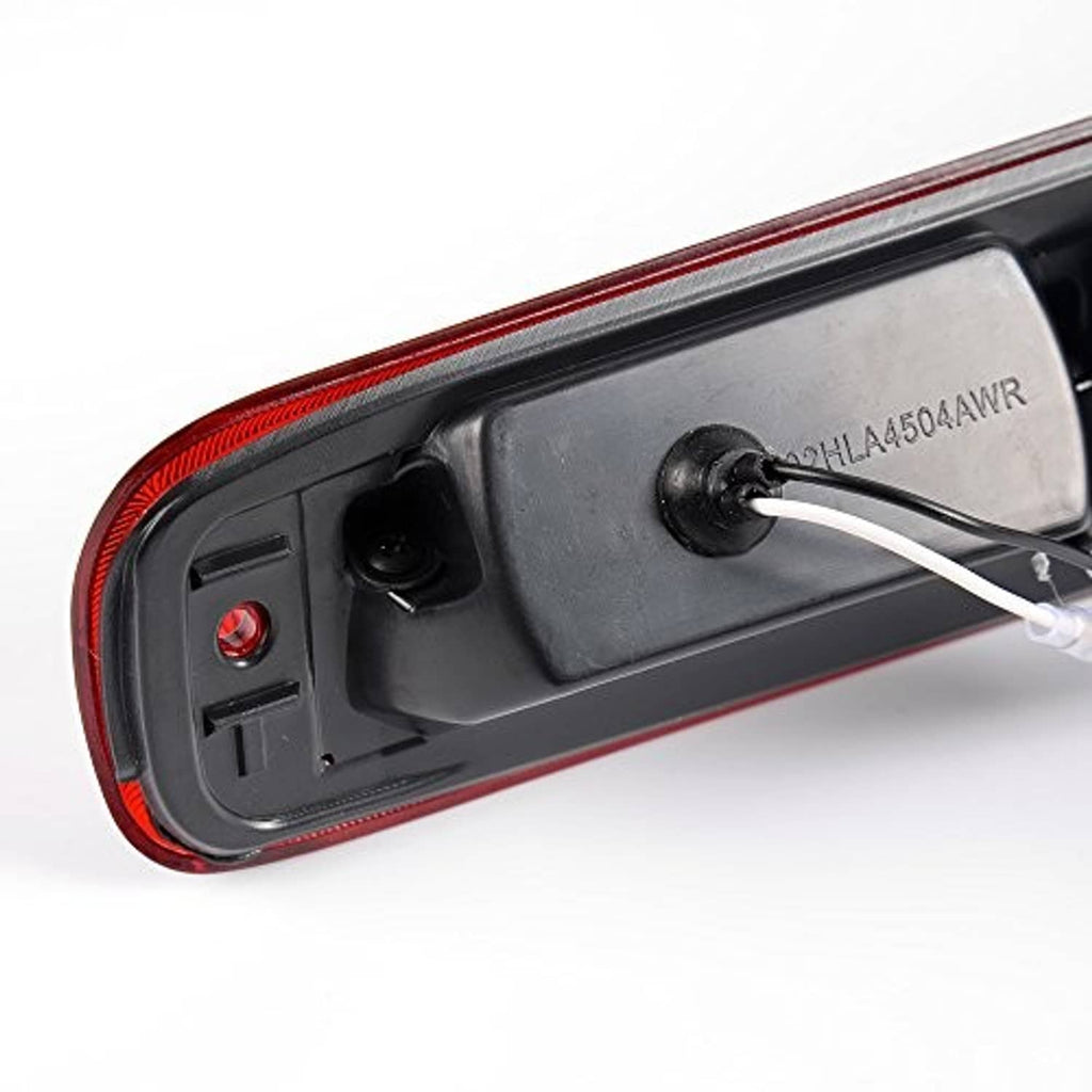 Red third brake light housing underside with mounting points and wiring lead