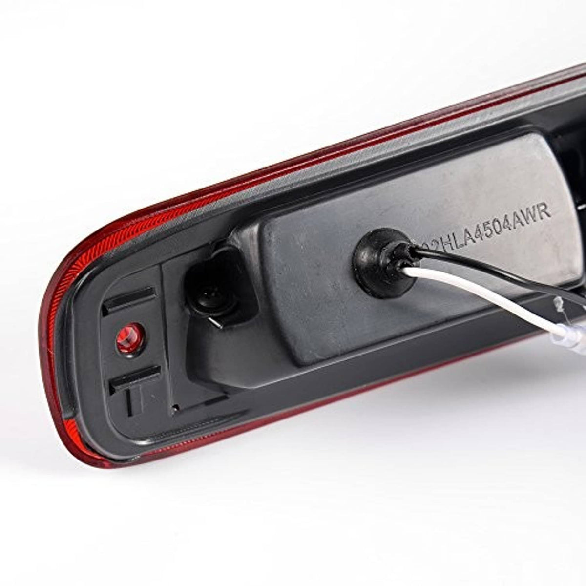 Red third brake light housing underside with mounting points and wiring lead