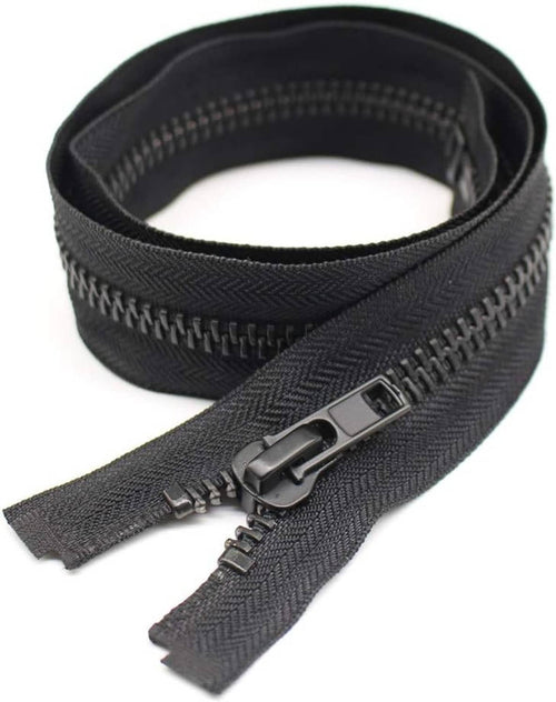 Separating zipper roll with dark fabric tape and black metal teeth, slider attached.