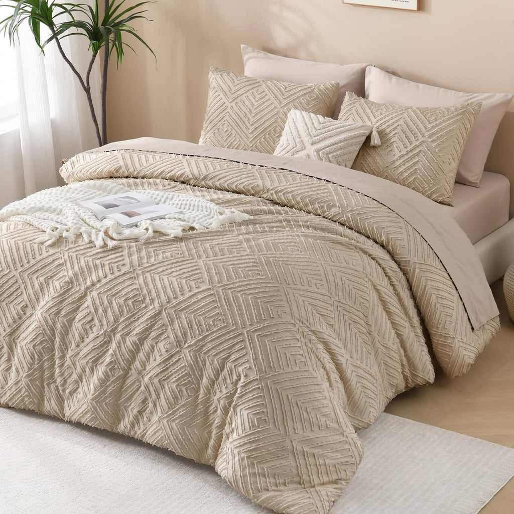 Light beige patterned comforter set with matching shams on a bed