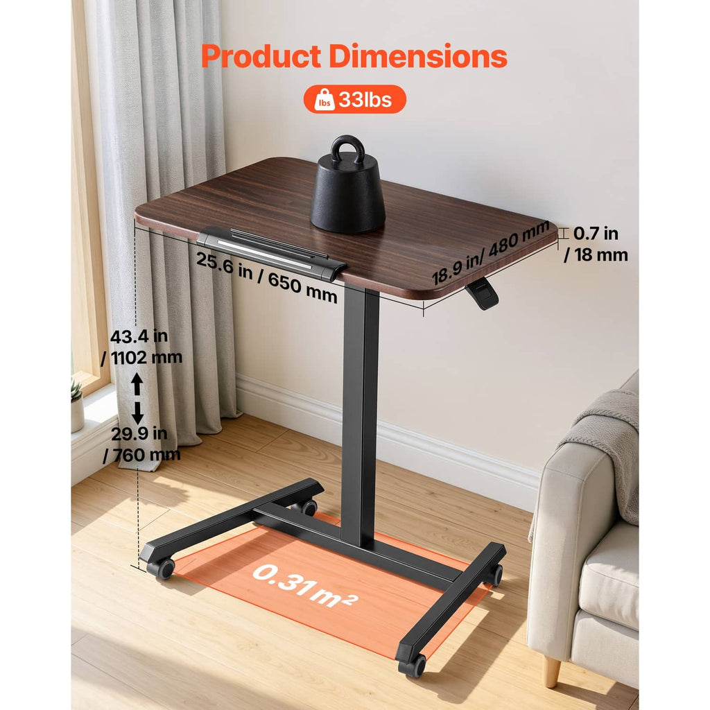 Tilting standing desk with brown wood top, gray column, and four caster wheels