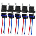 Set of 5 black SPST automotive relays with blue bases and red/blue/white wire leads