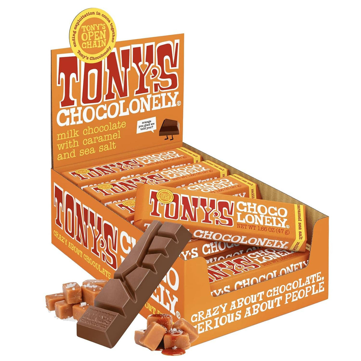 Tony’s Chocolonely milk chocolate bar with caramel & sea salt, orange box and chocolate pieces