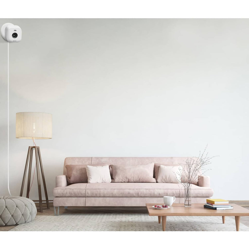 White USB-C power cable connected to an indoor security camera