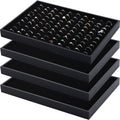 Stackable black ring holder trays with velvet-lined 100 ring slots