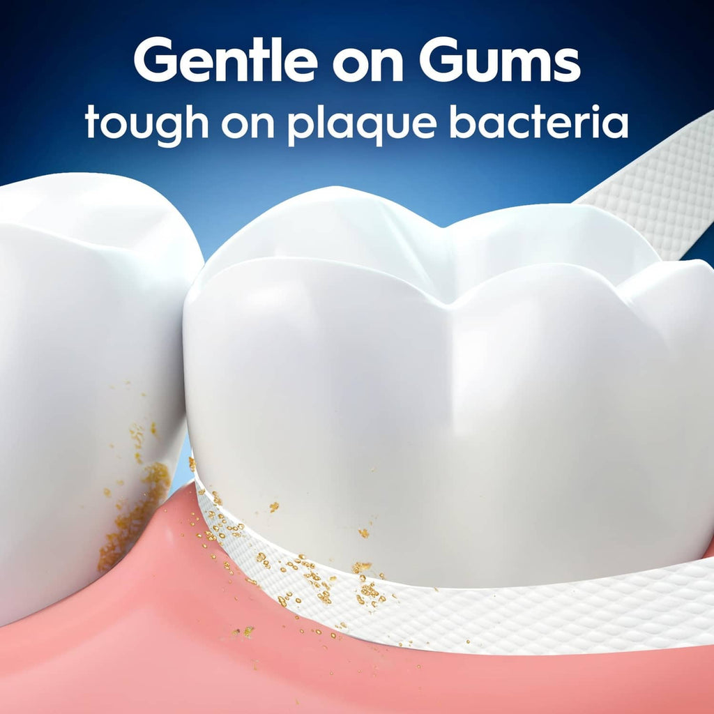 Dental floss cleaning around gums, showing plaque bacteria particles