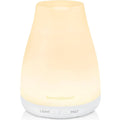 White essential oil diffuser with soft glowing top and mist nozzle base