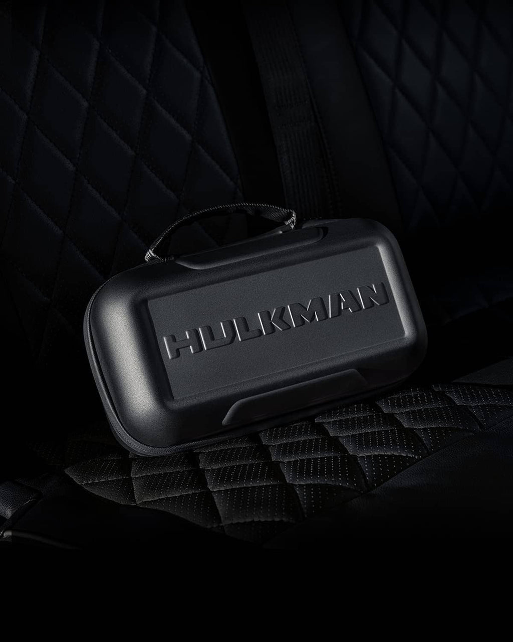 Black EVA protective case on quilted surface with HULKMAN logo panel.