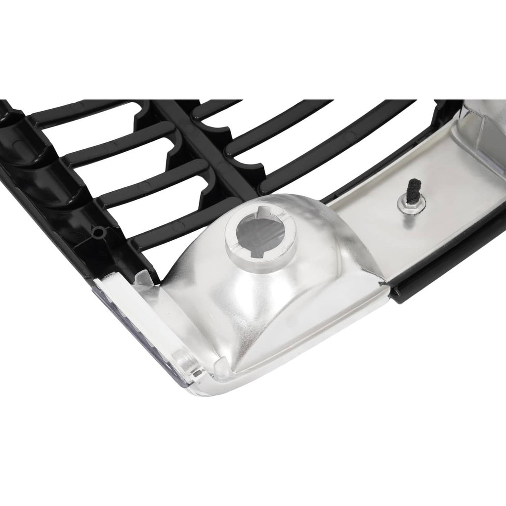 Black ABS grille viewed from side angle with clear headlight lens and mounting area
