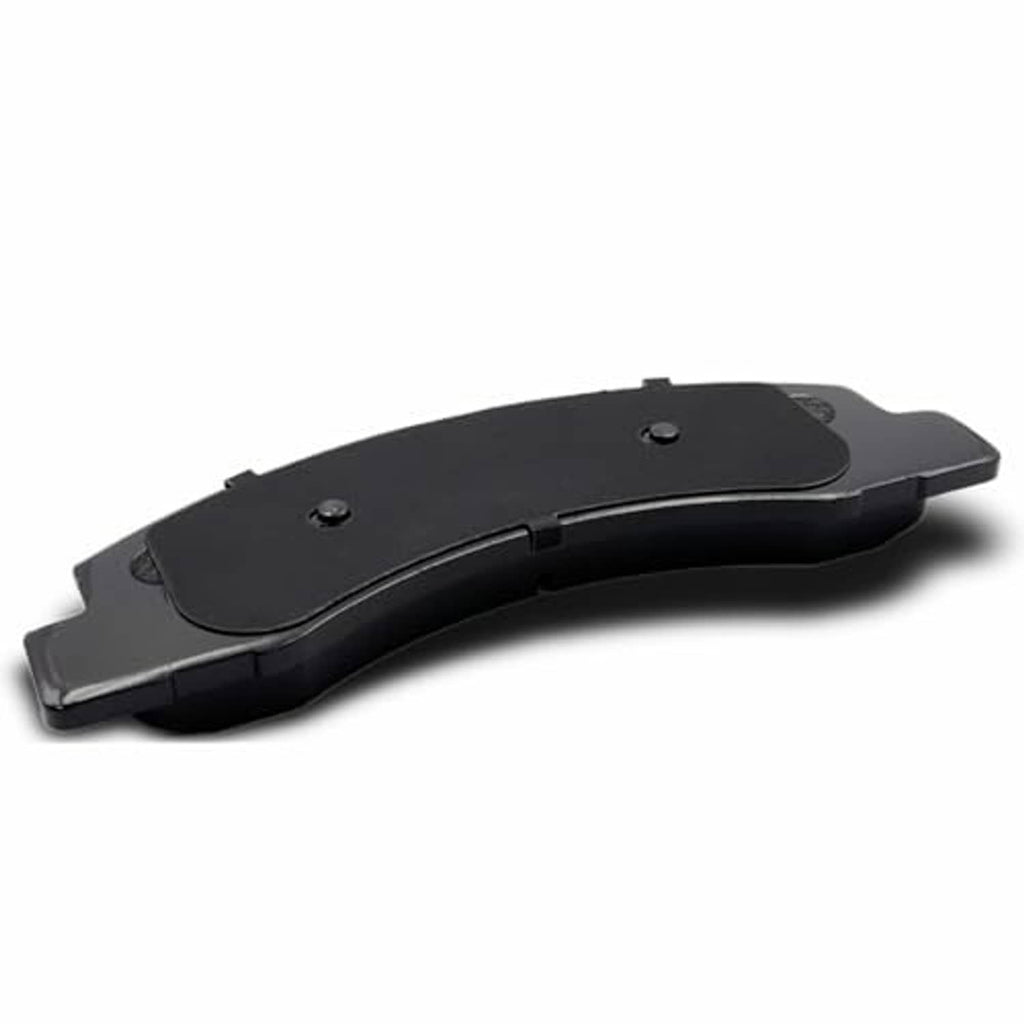 Ceramic brake pad rear side with black backing plate and mounting holes