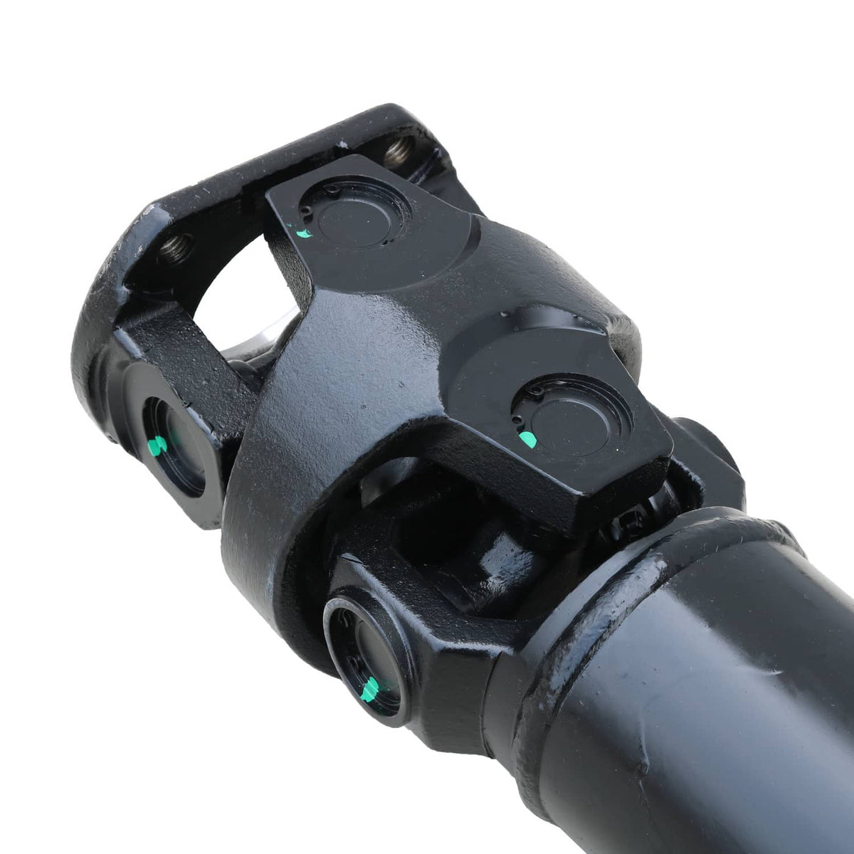 Close-up of rear driveshaft u-joint yoke with bolt holes, dark steel housing