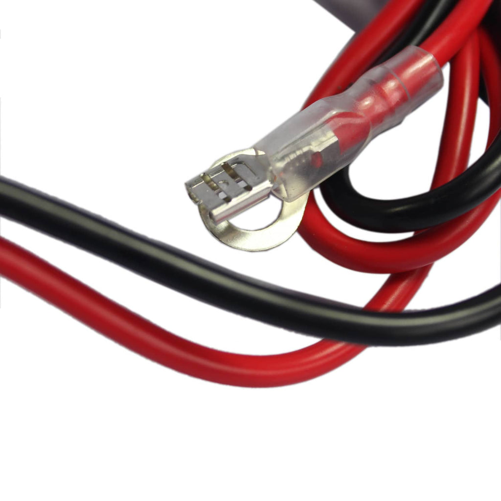Close-up of air compressor wiring connections with red and black insulated leads