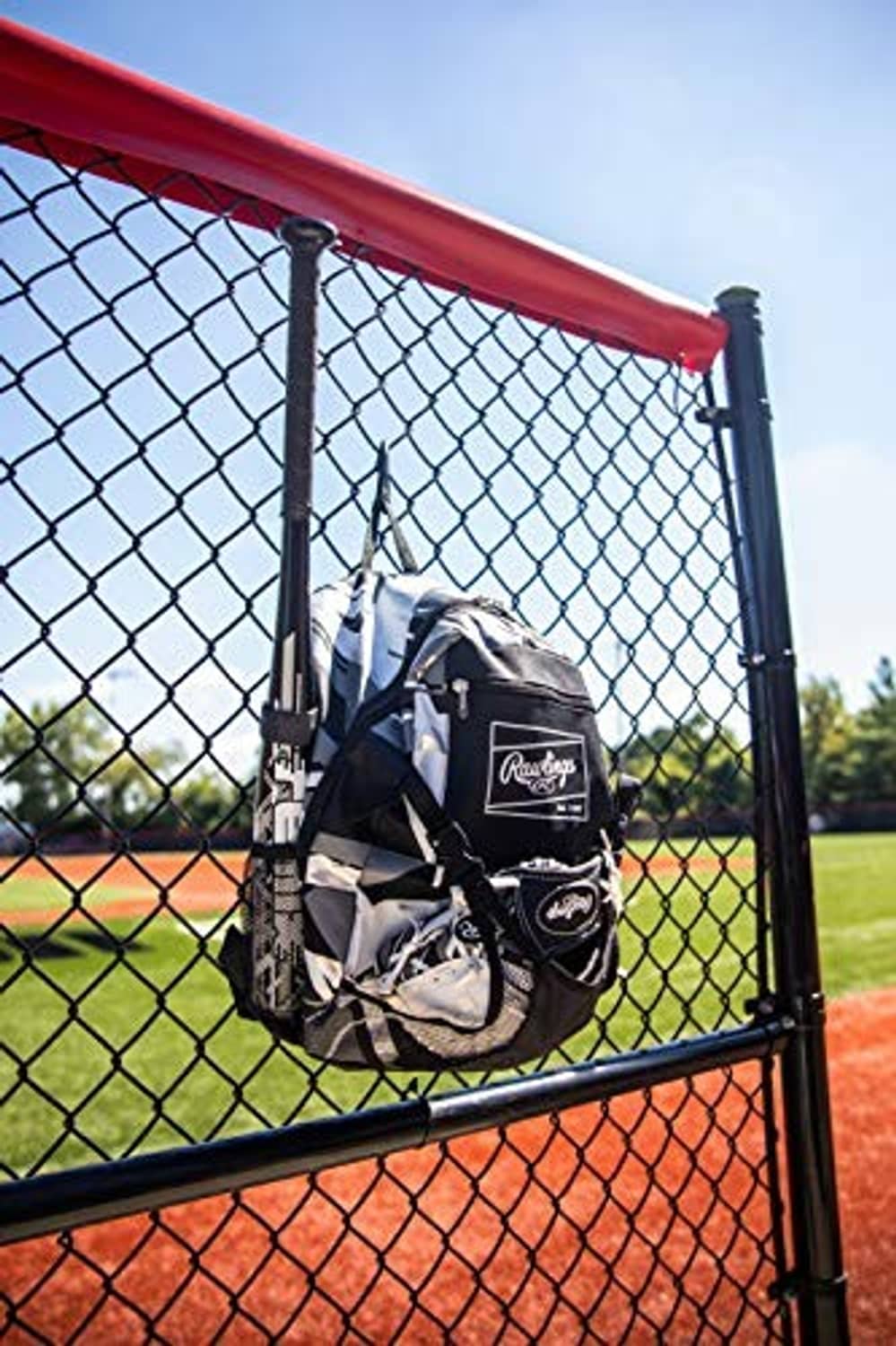 Baseball equipment backpack with black-and-white geometric print, front logo pouch and bat holder.