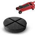 Black round floor jack pad with ribbed cross-slit traction surface.