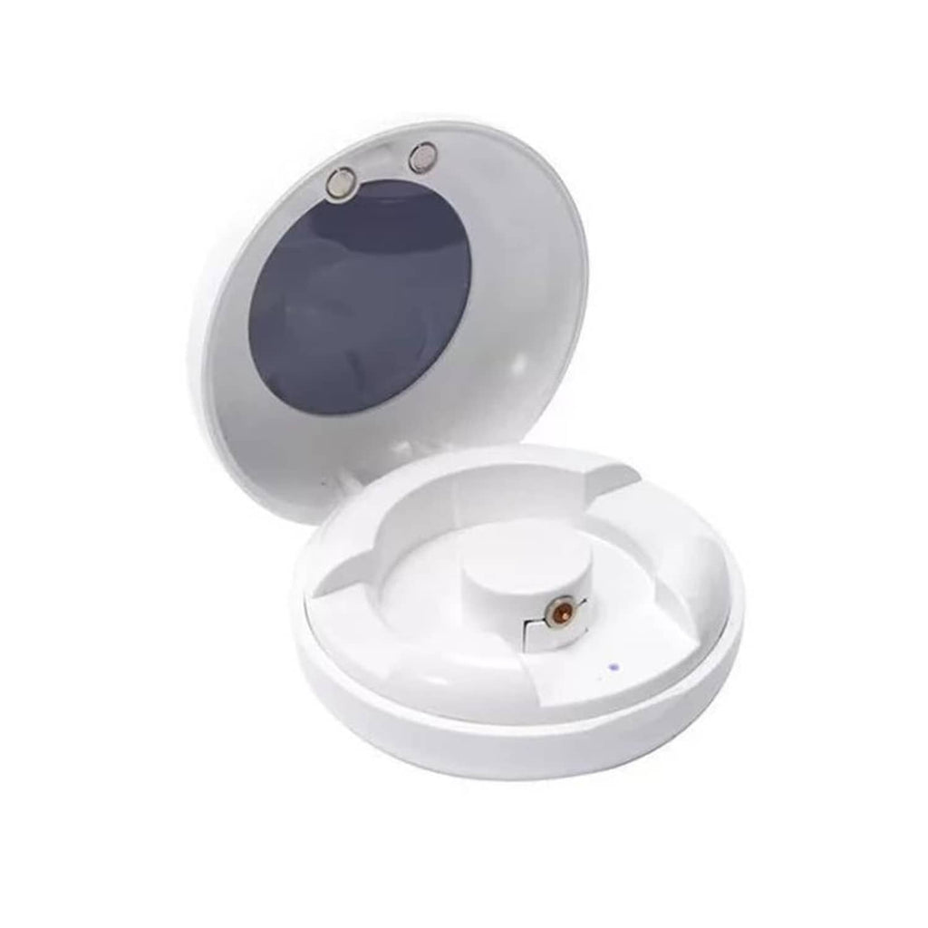 White smart ring charging case with open lid and charging cradle