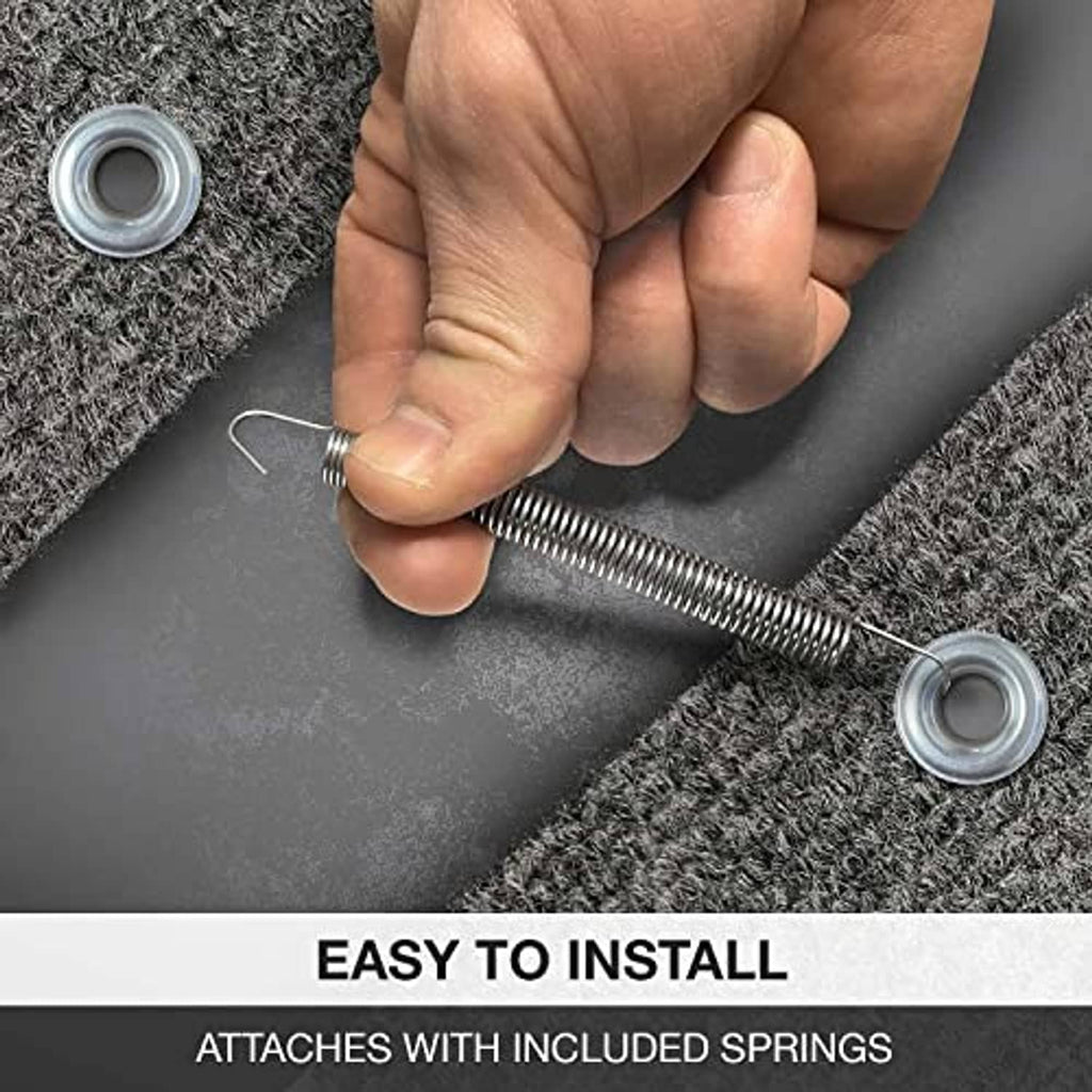 RV step rug installation showing hand installing springs on gray mat