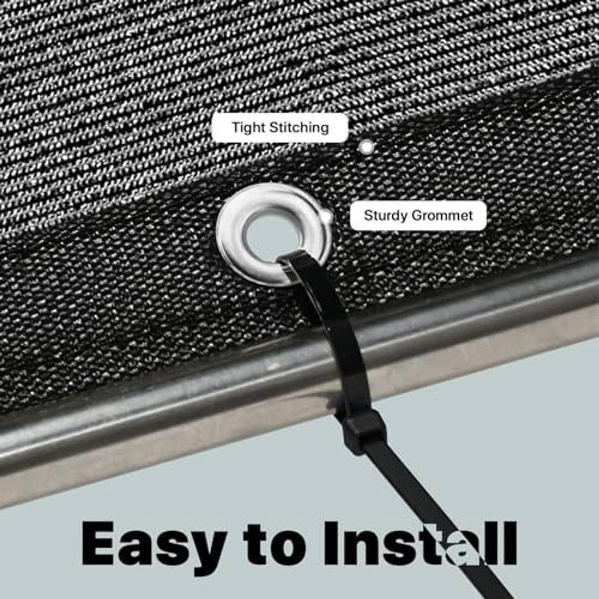Close-up of black shade cloth edge with metal grommet for easy installation