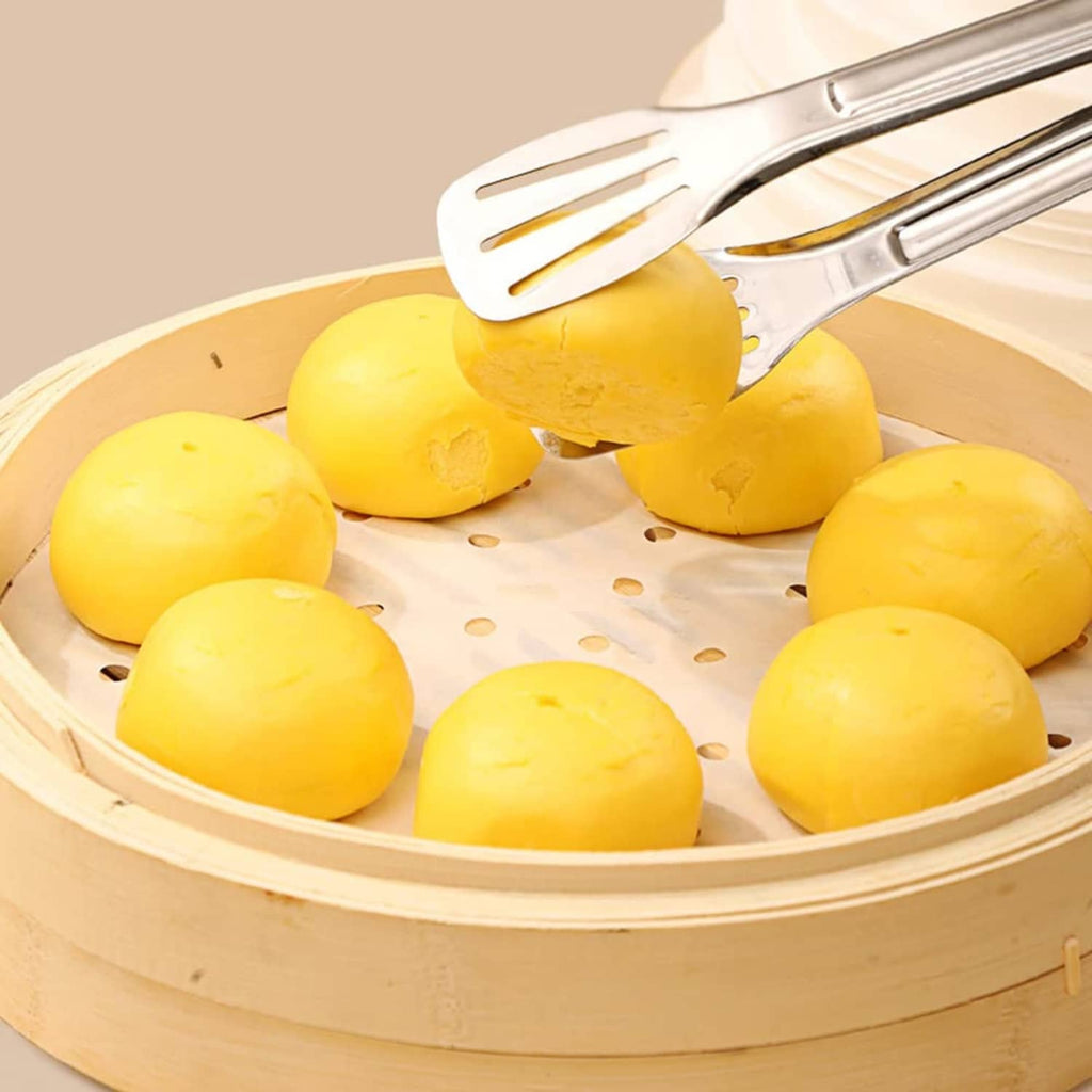 Round white parchment liner with holes covering yellow food in an air fryer