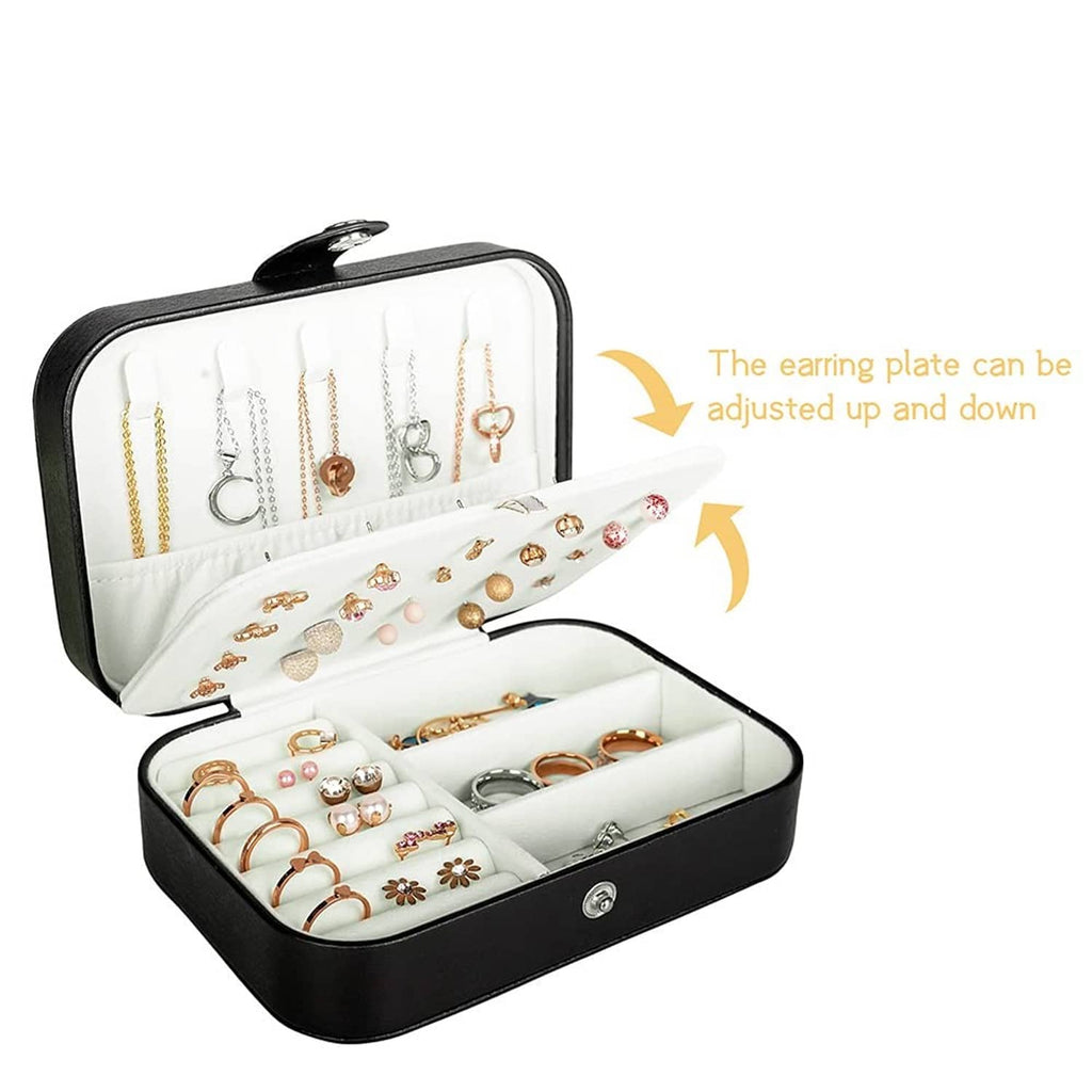 Black PU leather jewelry box open, showing adjustable earring plate and ring slots